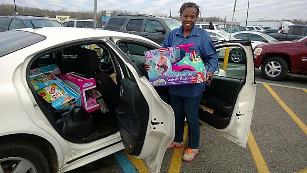 Michael Johnson’s foundation provided a whole car full of toys for this family in Selma. Johnson and members of the Tampa Bay Buccaneers gave back to children in Selma and Tampa Bay for Christmas.--Submitted Photo