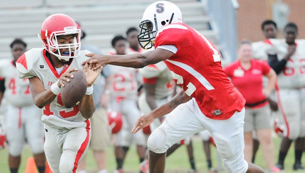 Southside’s TreDarius Smith pressures the Central Tuscaloosa quarterback during the team’s scrimmage game Thursday. The Panthers held Central to just one offensive touchdown in the game. --Daniel Evans