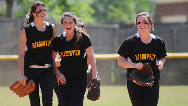 Meadowview Christian’s Tayler Roberts, Mllory Freine and Kinley Vardaman laugh as they run off the field during Friday’s game against Tabernacle Christian. Meadowview defeated Tabernacle 13-5 but fell to New Life Christian later 13-6.--Daniel Evans