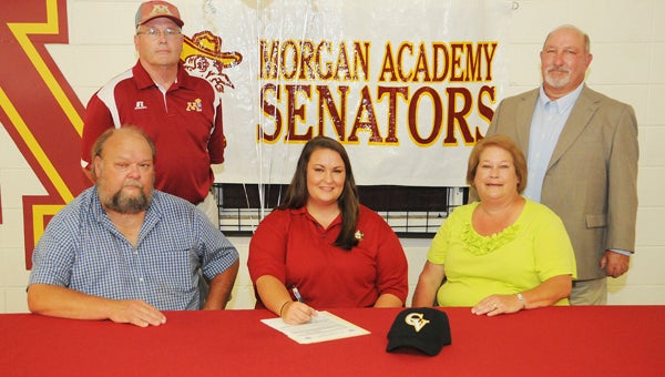 Morgan Academy senior softball player Margaret Mims signed Monday to play collegiately at Chattahoochee Valley Community College in Phenix City.  Margaret signed with her parents Mark and Mary Margaret by her side in the front row. Behind them are Morgan Academy head coach Ed Miller and Chattahoochee Valley head coach Steve O’Steen.--Daniel Evans