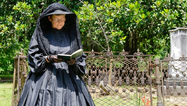Anne Dalton reads during a ceremony for Mary Louisa Portis, a newborn baby born in 1853 whose stolen headstone was returned to Old Cahawba Saturday.--Alaina Denean Deshazo