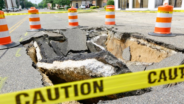 A large sinkhole formed Monday night or Tuesday morning on Lauderdale Street, due to a century old clay pipe for storm water collapsed. The road is caved in the hole is surrounded by road cones and caution tape.--Alaina Denean Deshazo