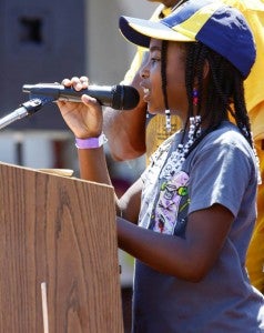 Radiance Ransom leads the Pledge of Allegiance during Saturday's rally. 