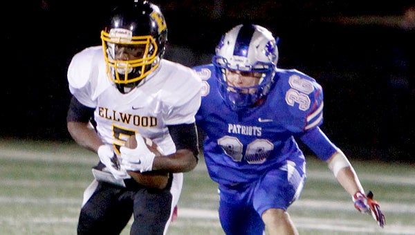 Elwood’s Macio Johnson is pursued by American Christian’s Cameron McBride at American Christian Academy. Ellwood lost the game 53-20. --Tuscaloosa News