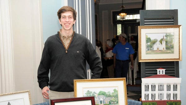 A Selma native Porter Rivers shows off his watercolor art at Sturdivant Hall’s Artisans Fair Saturday. Rivers, who has only been watercolor painting for a year, uses the historical buildings of Selma as his inspiration.