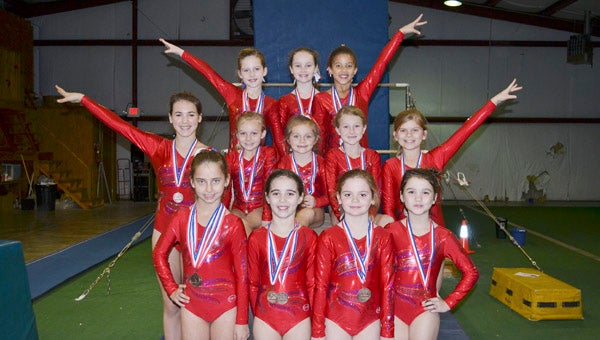 Pictured are the Dixie Flips Gymnastics Team at the State Compulsory Gymnastics Meet in Tuscaloosa earlier this month. Front row (left to right): Shyana Montoro, Madalyn Stevens, Brooke Egbert and Cameran Duncan;  middle row: Ruth Stevens, Alyssa McCloud, Addie Fancher, Hadley Verhoff and Keenan Lee McHugh; back row: Molly Bohannon, Evey Craig and Jaden McGee.--File Photo