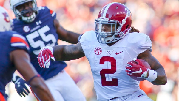 Alabama running back Derrick Henry runs around the end during this season’s game against Auburn at Jordan-Hare Stadium.  Henry became the second player in the University of Alabama’s history to win the Heisman Trophy Saturday night. --File Photo