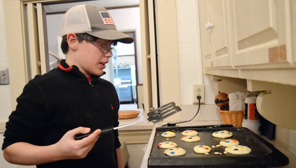 Drew Hisel, 12, makes M&M pancakes for the annual Pancake Supper and Little Friend’s Art Show at St. Paul’s Episcopal Church on Feb. 9.-- Emily Enfinger