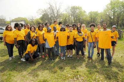 Excel members from the Noble and Greenough School in Dedham, Massachusetts are pictured with R.B. Hudson Middle School students at the Grow Selma Community Garden.