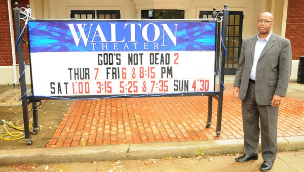 Pastor John Grayson is pictured at the Walton Theater. He took over at the theater one year ago. --Chelsea Vance