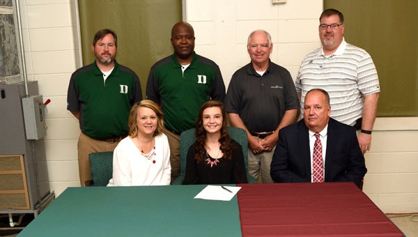  Dallas County’s Tori Hatfield poses for a photo before signing paperwork to play softball with Judson College. She’s joined on the front row by her mother, Sheila Hatfield and father, John Hatfield. On the back row are Dallas County softball coaches Josh Howard and WIllie Moore, Judson College coach Lee Jones and Dallas County principal Todd Reece. — Daniel Evans