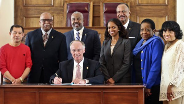 Alabama Gov. Robert Bentley signs an executive order Wednesday creating the Governor’s Office of Minority Affairs in the Old House Chamber at the state capitol in Montgomery. The office will be responsible for advising the governor on issues affecting minorities, including women. The office will focus on the improvement of the overall quality of life of minorities, specifically in the areas of education, health, economics, political participation and empowerment, housing, employment, civil rights, criminal justice and race relations.