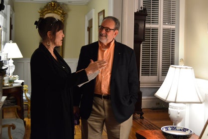 Tour guide Ruth Shaw tells Paul Bolig about the Smith-Walker home on Friday
