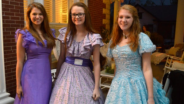 Junior Hostesses Kinsley Mott, 16; Caitlyn Piper, 13; and Mary Claire White, 19, at the Smith-Walker home on Friday, March 18.