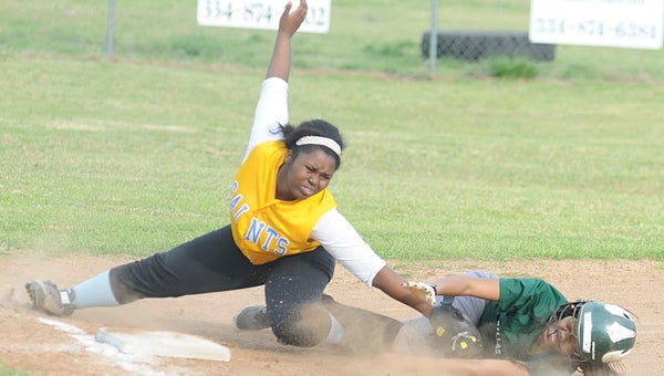 Selma’s Denetra Whitlock tags Dallas County’s Calandra Morrow during Wednesday’s game at Dallas County High School.  Morrow was out on the play and was a little shaken up after the hard slide into the bag.  The Hornets won the game 13-3 in five innings. — Daniel Evans