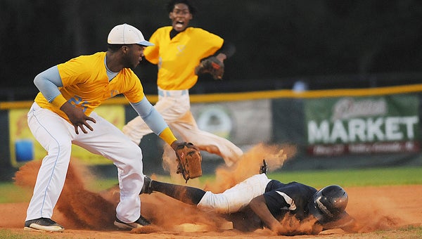 Selma’s Kiwansis Jones reaches down to try to tag a Calhoun runner out at third base during Tuesday’s game at Bloch Park. --Daniel Evans