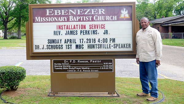  James Perkins, Jr. stands outside of Ebenezer Missionary Baptist Church, where he will be installed as pastor Sunday at 4 p.m.  Perkins has served as the church’s associate pastor for the last two years. --Chelsea Vance