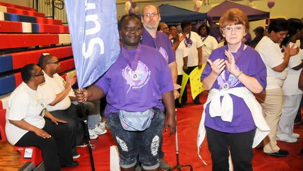 ancer survivors including Ovetta Moultrie (left), John Harper (center) and Linda Morenzoni (right) kick of Friday’s Selma and Dallas County Relay for Life Walk.