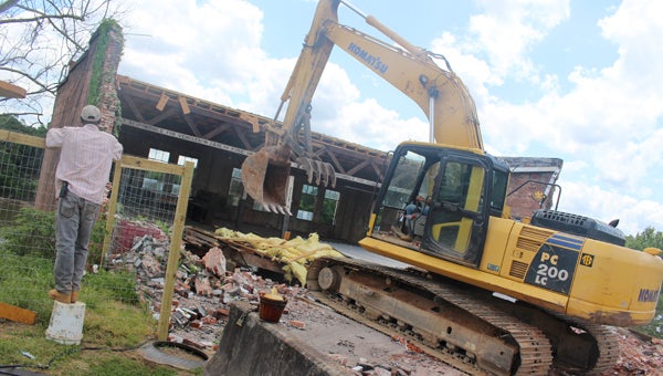 Demolition of the old Safelite building on Water Avenue started Monday morning. The building’s roof partially collapsed April 13 after a line of thunderstorms moved through the area. 