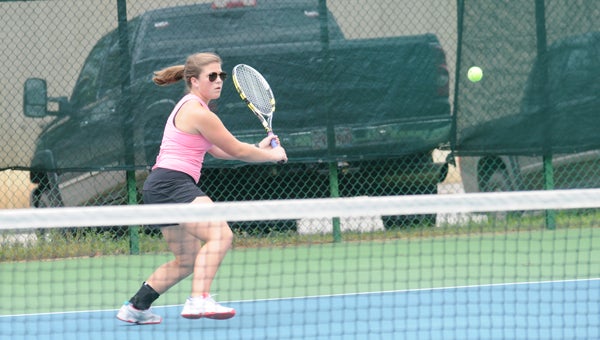 Morgan Academy’s Emily Sherrer hits a backhand in a No. 2 singles match against Tuscaloosa Academy’s Natalie Arnold Tuesday at Lagoon Park.  Sherrer lost 6-4, 6-2. — Justin Fedich