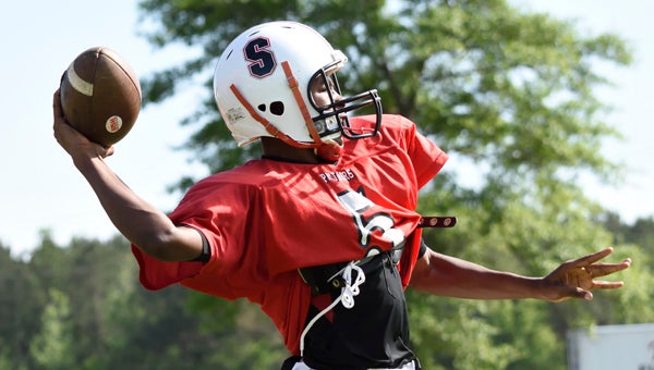 Southside sophomore Malik Johnson throws a pass during Tuesday’s spring practice at Southside High School.  --Daniel Evans