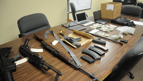 The Dallas County Sheriff's Department inventoried firearms, bags of marijuana and electronics after arresting 32-year-old Andrae Ellis and 19-year-old Ladarius Parker in connection to a burglary on the 900 block of County Road 83.