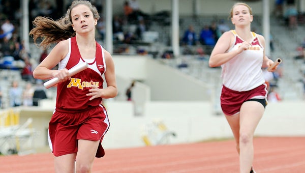 Morgan Academy seventh grader Grace Wilkinson runs the second leg of a 4x400 during the Alabama Independent School Association state track meet Wednesday at Memorial Stadium.  The Morgan girls finished sixth overall in the meet, while the Morgan boys finished eighth. — Justin Fedich