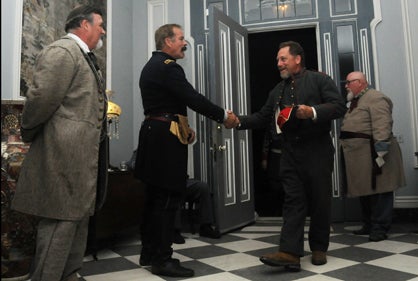 Mississippi re-enactor Daniel Lumpkin is greeted as he enters Sturdivant Hall Saturday night for the annual Battle of Selma Grand Military Ball. 