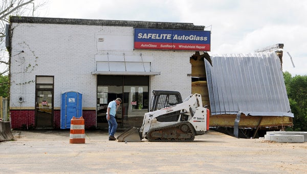 The roof and a wall on the Safelite Autoglass building on Water Avenue fell following storms on Wednesday evening.  --Emily Enfinger