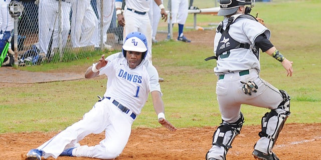 Selma University’s Daryl Watkins slides home in a game on March 11 against Concordia College Alabama.  The Bulldogs are 24-8 and nearing the end of the regular season. On May 25, they will play in the National Christian Collegiate Athletic Association World Series in Mason, Ohio.