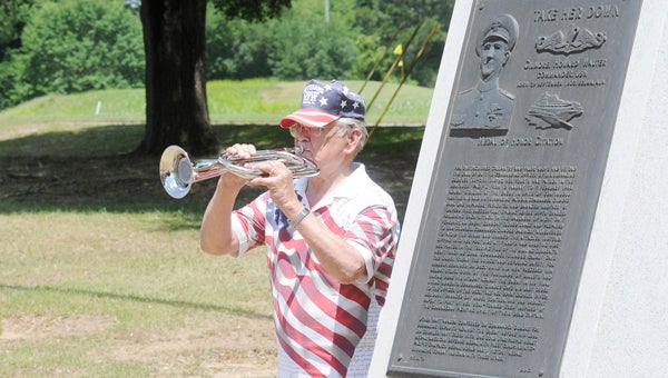 Jesus Sanchez, a member of the Thomas R. Mackin American Legion Post 20 and Veterans of Foreign Wars Post 3016, gives a musical tribute  during Monday’s Memorial Day program at Memorial Stadium. 