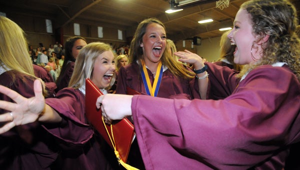 Shown celebrating graduation from Morgan Academy are JoAnna Alisa  Adkison, Owen Taylor Roberston and Mary Lauren Stewart.