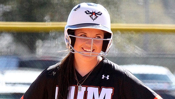Auburn University at Montgomery’s Amy Persinger smiles while standing on base during a game earlier this season. Persinger and AUM are chasing a third straight national championship.