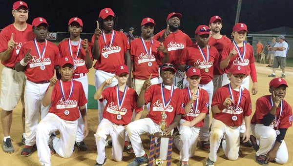 The 11-and-12 -year old Selma All-Star team poses for a photo after winning the district 4 sub-district tournament in Holtville on Tuesday night.  The players on the team are Derick Brown, Joshua Brown, Kenneth Dukes, Kemari Eaton, Benjamin Feister, Jamichael Goings, Matthew Hand, Nathan Johnson, Matthew King, Jataveon Spears, Arron Strong and Athur Lee Vaughn. 