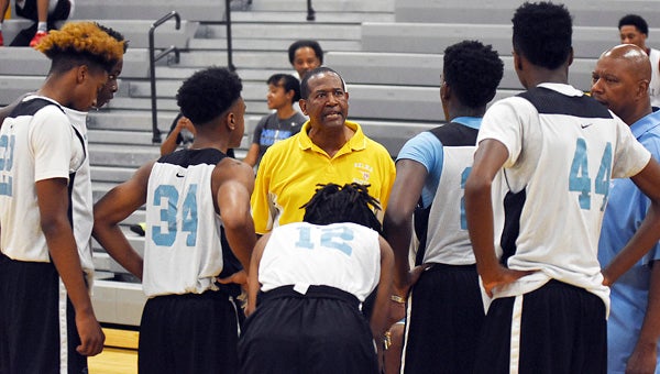 Selma coach Anthony Harris tries to fire up his team during a timeout.  --Daniel Evans