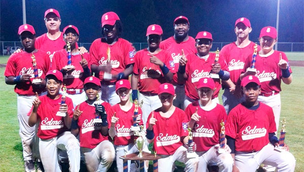The 11-and 12-year-old Selma All-Star team won its district tournament by beating Grove Hill 8-2 and 13-1. Front Row (L-R) JaMicheal Goings, A.J. Vaughn, Matthew King, Nathan Johnson, Ben Feister and Josh Brown; Second Row (L-R) Kenneth Dukes, Tae Spears, Derrick Brown, Aaron Strong, Kemari Eaton and Matthew Hand; Back Row (L-R) Coaches Jerome Hand, Arthur Vaughn and Jason King. --Submitted Photo