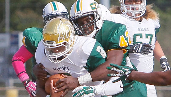 Concordia College Alabama’s Cameron Walton tackles a running back for Tiffin during a game last season at Memorial Stadium.  Walton is one of six players nationally eligible for the NFL’s supplemental draft. --File Photo