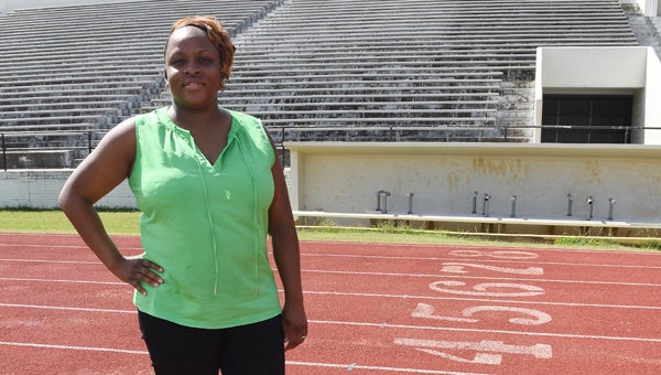 Carneetie Ellison, interim director of the Selma Parks and Recreation Department, poses for a photo Thursday at Memorial Stadium. 