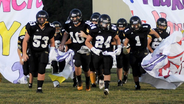 Meadowview Christian takes the field for its game against Victory-Millbrook last season.  The Trojans went on to play in a state semifinal game, which was won by Victory.  Meadowview and Victory will play again this season on Sept. 30.  --File Photo