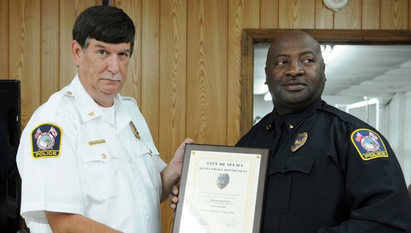 : Selma Police Chief John Brock officially promoted Lt. Reginald Fitts during a promotion ceremony Tuesday afternoon.  --Emily Enfinger