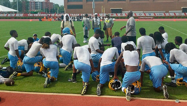 Selma huddles up during a timeout in last week’s 7-on-7 camp at the University of Alabama. --Submitted Photo