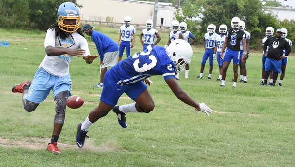 Selma defensive back Nick Parnell defends a Sidney Lanier wide receiver Wednesday during one-on-one passing drills between the schools.  --Daniel Evans