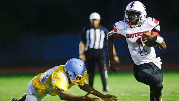 Southside’s DeQuan Johnson races down the sideline during last season’s game against rival Selma at Memorial Stadium.  The teams will open the season against one another on Aug. 26.  The Panthers will also play a jamboree game against Dallas County on Aug. 19.  --File Photo