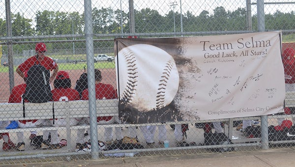 The Selma baseball team sits in the dugout during Saturday’s game against Florida.  --Submitted Photo