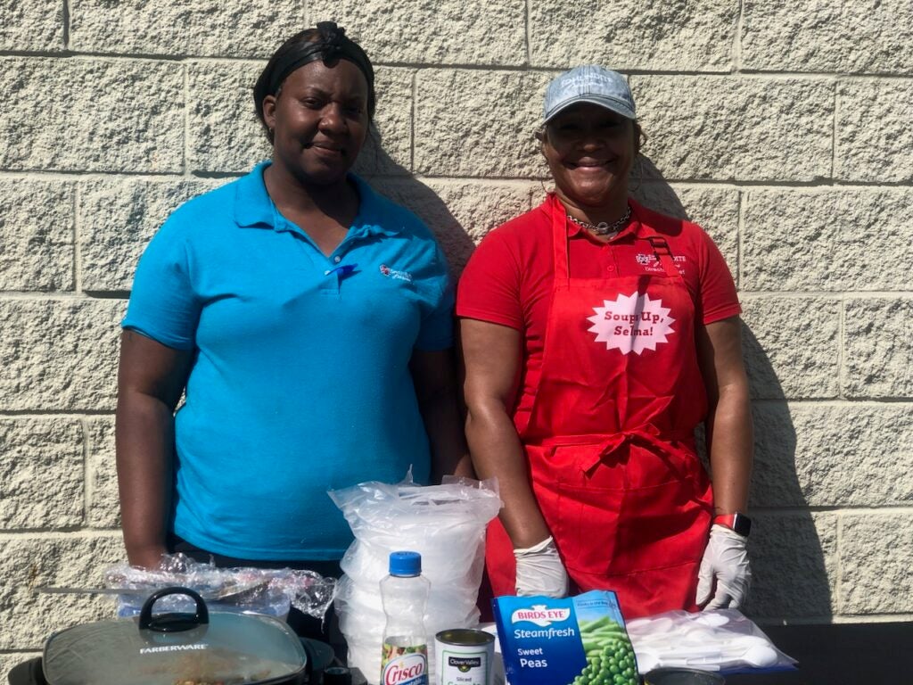 Destiny Underwood and LaTanya Lawrence, director of Bosco Nutrition, hold a cooking demonstration at Dollar General.